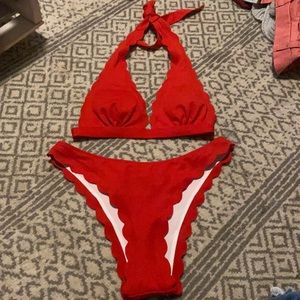 a red cute styling bathing suit .